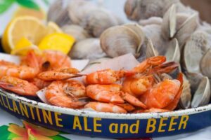 A plate of freshly steamed shrimp and clams enjoyed at the Chincoteague Seafood Festival at Tom’s Cove Park.